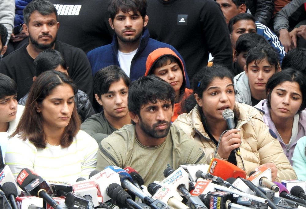 New Delhi: Indian wrestlers including Vinesh Phogat, Bajrang Punia and Sakshee Malikkh address a press conference during a protest against Wrestling Federation of India (WFI) president Brijbhushan Sharan Singh, at Jantar Mantar in New Delhi on Thursday, January 19, 2023. (Photo: Anupam Gautam/IANS)
